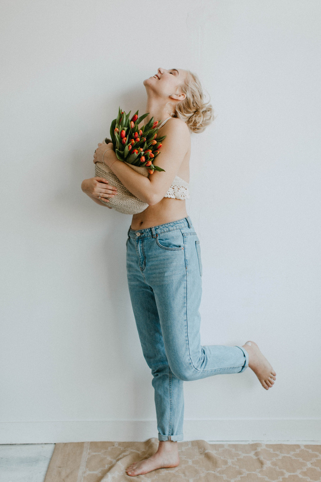 Happy Woman with Bouquet of Flowers