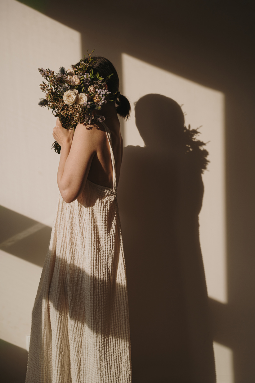 Woman Holding Bouquet of Wildflowers
